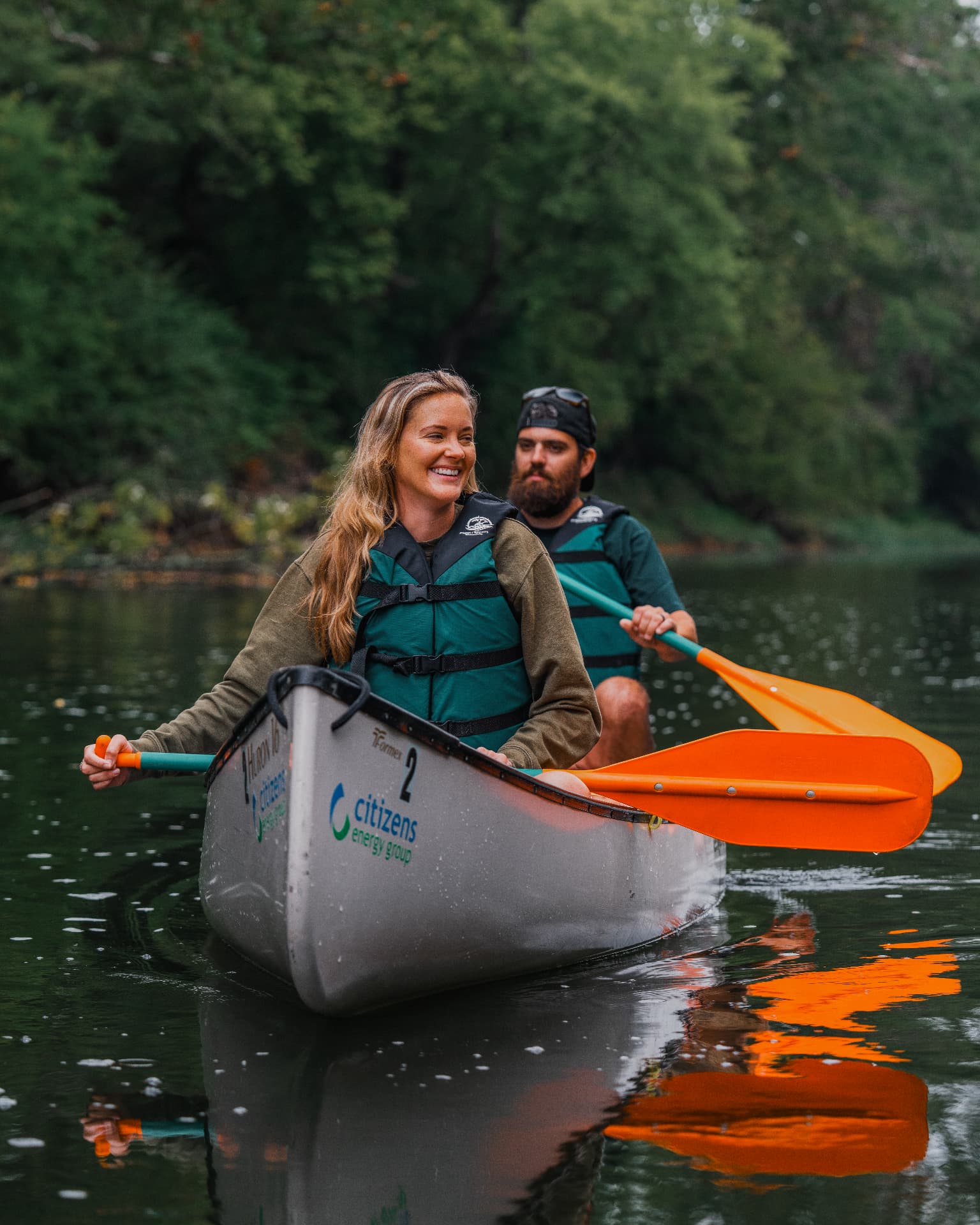 Two people paddling a canoe on the river